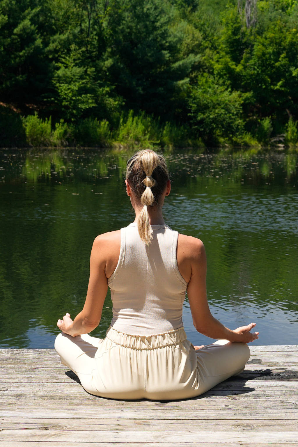 Yoga pranayama and meditation at a lake.